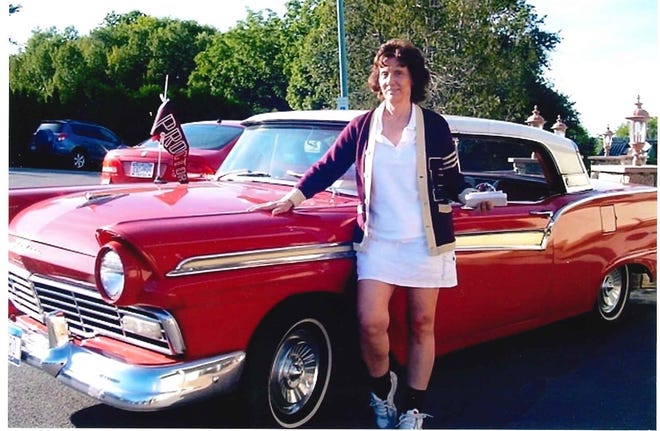 50’s bobby-soxer Corky Romagnoli posing in 2008 next to Bobby D’s ’57 Ford Skyliner. [SUBMITTED PHOTO]