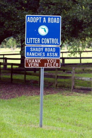 County officials are hoping more signs like this one will start cropping up across Marion County as they encourage residents to Adopt A Road as part of a stepped-up anti-litter campaign. [Alan Youngblood/Star-Banner]