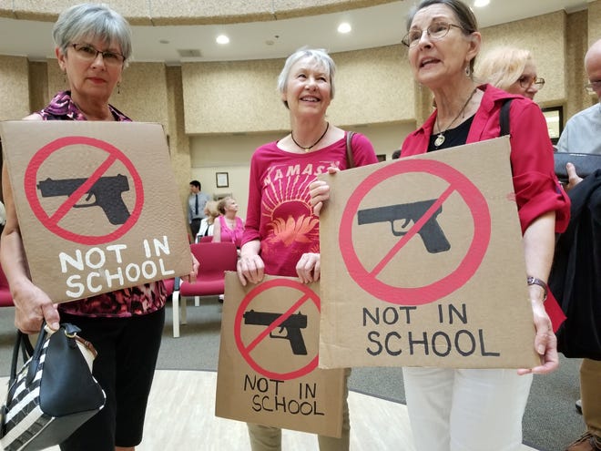 From left, Linda Kwiatt, June O'Conner and Cara Luchsinger wait for the Lake County School Board meeting in Tavares on Monday evening. The board was to discuss the idea of arming teachers and administrators. [CARLOS MEDINA / DAILY COMMERCIAL]