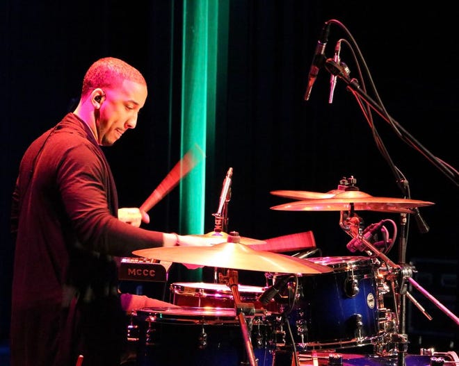 Photo by Vanessa Ray 

Drummer Jeremy Howard keeps the beat for headliner Anthony Gomes during his set at The Big Gig! Sat. night at Monroe County Community College. (Photo by VANESSA RAY)