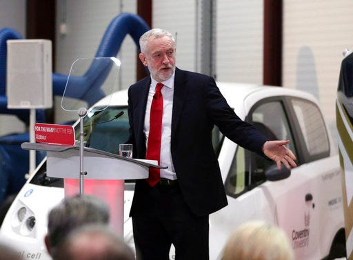 Britain's Labour party leader Jeremy Corbyn delivers a Brexit speech at the National Transport Design Centre (NTDC), Coventry University Technology Park, in Coventry, England, Monday Feb. 26, 2018. Corbyn said Monday that the U.K. must retain close economic ties with the European Union after Brexit, including a tariff-free customs deal with the European bloc.(Aaron Chown/PA via AP)