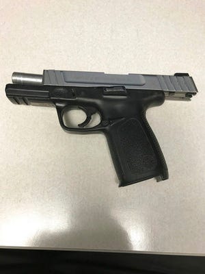 This Monday, Feb. 26, 2018, photo provided by the Philadelphia Police Department shows a stolen .40-caliber handgun that police say a 15-year-old boy tried to bring into a high school, loaded with a dozen rounds, that morning in Philadelphia. Police say the gun was found when the unnamed boy's bag was scanned at Samuel Fels High School, which was placed on lockdown. A police spokesman said the gun had been reported stolen from a car near the home of the student, who had no disciplinary problems or known issues with classmates, but now faces weapons charges. (Philadelphia Police Department via AP)