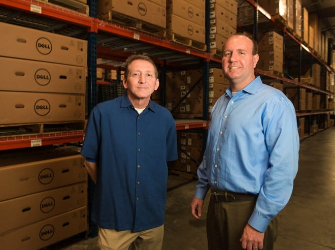 xByte Technologies founder and chairman Tom Santilli, left, and CEO Ryan Brown at their company in Bradenton. [Herald-Tribune staff photo / Dan Wagner]