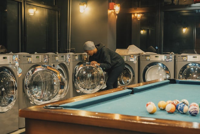 The well-equpped laundry room at a WeLive facility, a complex of about 200 fully furnished apartments rented out on a short-term basis, in New York. [Cole Wilson / The New York Times]