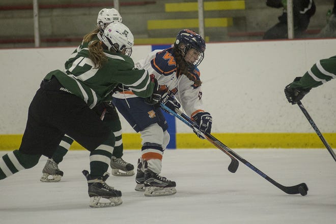 Walpole junior Olivia Malone, seen in last week's game with Canton, had four goal in a 5-2 win over Matignon in the Rebels' tournament opener. Wicked Local Photo/Sean Browne