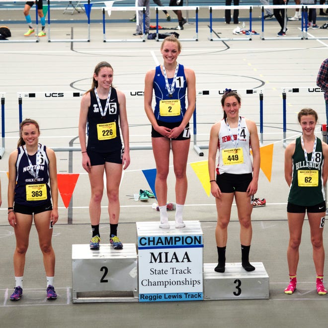 Acton-Boxborough's Sam Friborg (3rd from left) with her first-place medal in the 1,000 meters at the MIAA All-State meet. [Courtesy photo]