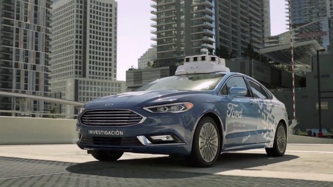 In this undated image made from a video provided by Ford Motor Co., a self-driving vehicle from Ford Motor Co. and Ford partner Argo AI drive the streets of Miami, Fla. Ford is making Miami-Dade County its new test bed for self-driving vehicles. (Ford Motor Co. via AP)