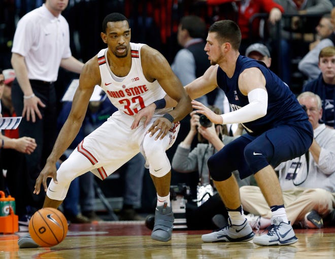 FILE - In this Jan. 25, 2018, file photo, Ohio State forward Keita Bates-Diop, left, drives against Penn State forward Deivis Zemgulis during an NCAA college basketball game in Columbus, Ohio. Chris Holtmann’s first season coaching at Ohio State was a hit after the Buckeyes exceeded preseason expectations to finish 15-3 in the league to get the second seed in the Big Ten conference tournament. Bates-Diop, who averages 19.2 points and 8.9 rebounds per game, won league player of the year honors. (AP Photo/Paul Vernon, File)