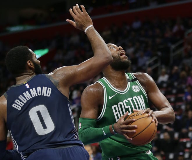 Celtics center Greg Monroe, shown driving to the basket past Pistons center Andre Drummond (0) during game on Feb. 23, did not play in Monday's victory over the Grizzlies. [AP File Photo/Duane Burleson]