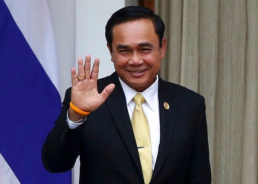 FILE - In this Thursday, Jan. 25, 2018, file photo, Thailand's Prime Minister Prayuth Chan-ocha waves during a visit to New Delhi, India. Prayuth, leader of the country's military government which took power in a coup in 2014, says Tuesday the country will have elections by February next year, though he suggested the date remains conditional on the political situation remaining calm. (AP Photo, File)