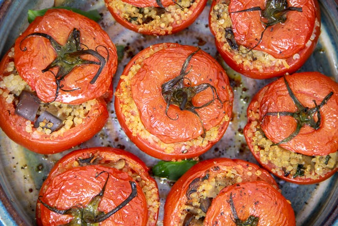 Tomatoes stuffed with quinoa are hearty enough without the ground beef. [MELISSA D'ARABIAN/ASSOCIATED PRESS]