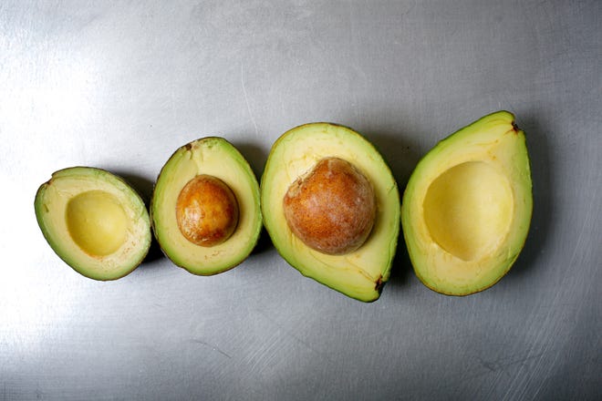 The Hass avocado, left, is the variety you're used to seeing in grocery stores. The slightly larger "SlimCado," right, isn't necessarily more slimming, but it's still worth trying. [DEB LINDSEY \THE WASHINGTON POST]