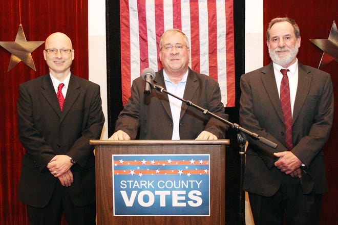 Circuit court judge candidates Robert Rennick Jr., left, and Bruce Fehrenbacher, right; and Mike Bigger, Stark County GOP chairman.