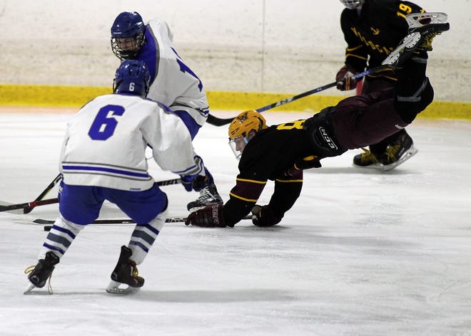 TJ Keefe finds himself airborne as he's tripped up by a Braintree stick. [Wicked Local Staff Photo/Alyssa Stone]