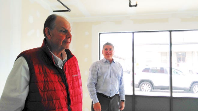 Bagel Table owners Ed Eglitis, left, and Curt Leiden, right, talk inside their newly leased space at 21 Main St., Ashland. [Daily News Staff Photo/Alison Bosma]