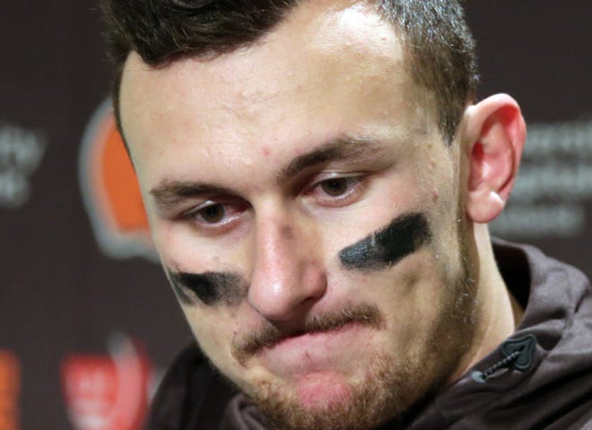 Cleveland Browns quarterback Johnny Manziel speaks with media members following the team's 30-13 loss to the Seattle Seahawks in a game Dec. 20, 2015 in Seattle. (AP Photo/Scott Eklund)