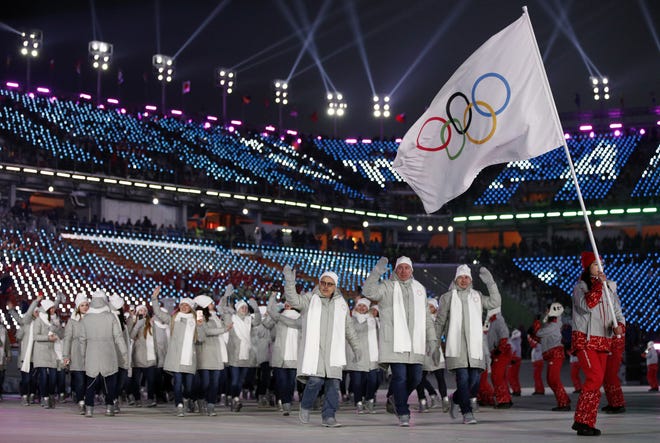 Athletes from Russia wave during the opening ceremony of the 2018 Winter Olympics on Feb. 9 in Pyeongchang, South Korea. [AP Photo / Jae C. Hong, file]