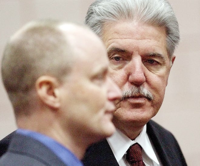 Gerald Hege (right) arrives with his attorney William Hill to a court hearing in 2003. Hege has filed to run for Davidson County sheriff again after having his criminal record expunged. [File photo by Donnie Roberts/The Dispatch]