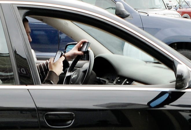 Florida is one of the few states that treats texting while driving as a secondary offense, meaning motorists can't be pulled over for it. A bill that would change that is running into concerns over whether it could be used to target minority drivers. [GateHouse Archives]