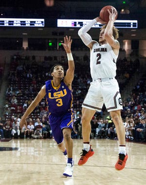 South Carolina guard Hassani Gravett (2) shoots as LSU guard Tremont Waters (3) defends during an NCAA college basketball game Wednesday, Feb. 28, 2018, in Columbia, S.C. (Gavin McIntyre/The State via AP)