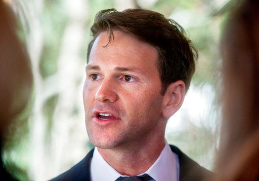 FILE - In this Nov. 10, 2016, file photo, former Illinois U.S. Rep. Aaron Schock talks to reporters in Peoria Heights, Ill. Growing sympathy for defense arguments, seeming confusion among the prosecution team and a disgruntled judge are some of the signs that the corruption case against Schock may be at risk of unraveling. (Matt Dayhoff/Journal Star via AP, File)