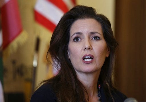 FILE - In this June 15, 2016, file photo Oakland Mayor Libby Schaaf answers questions during a news conference at City Hall in Oakland, Calif. Schaaf warned over the weekend of Feb, 24, 2018, that federal agents were planning immigration raids across the San Francisco Bay Area. Though no major immigration sweeps have materialized, Schaaf said it was her "ethical obligation" to issue the warning. (AP Photo/Eric Risberg, File)
