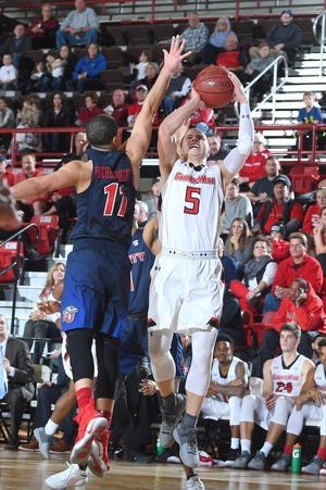 GWU's Liam O'Reilly, 5, lets a jumpshot fly in an earlier matchup with Liberty in Big South Conference play. The 'Dogs open the league tournament at 3 p.m. Thursday versus defending champion Winthrop. [Courtesy of GWU Sports Information]