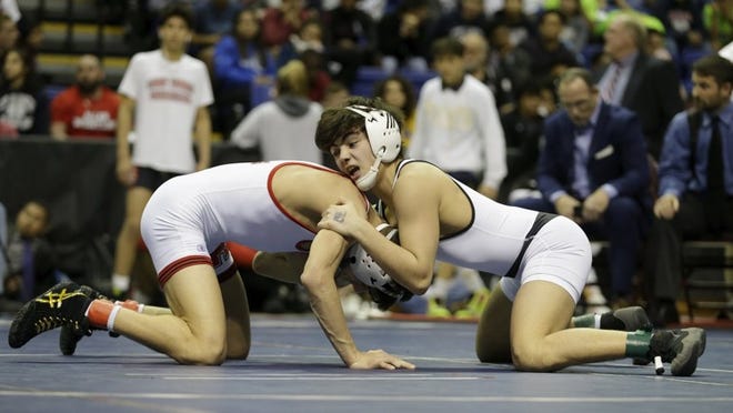 Vandegrift freshman Noah Gochberg, right, wrestles Allen’s Gabe Martinez on Saturday in the Class 6A boys 113-pound final at the UIL championships. Gochberg recorded a 7-6 victory to win a gold medal. CREDIT: Tim Warner/For American-Statesman