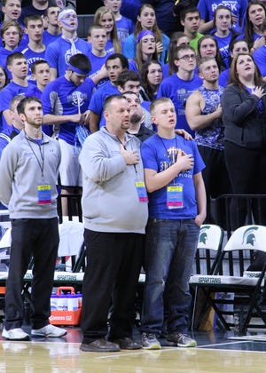 Pittsford girls basketball coach Chris Hodos sings the national anthem with his son Cage at the Breslin Center on the campus of Michigan State University. [FILE PHOTOS]