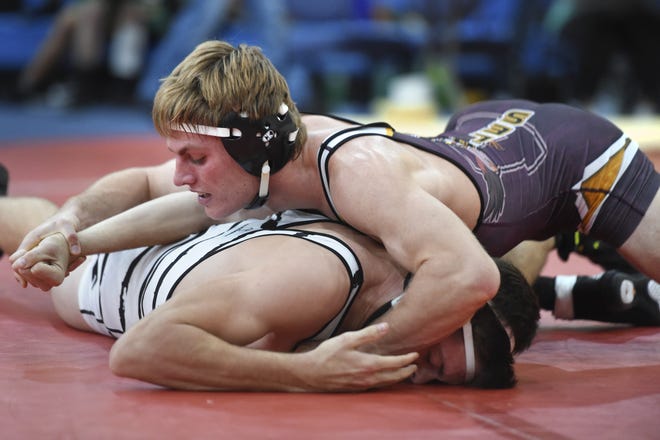 Niceville's Jack Johnson wrestles opponent Ryan Donnelly from Smiths Station High School on Friday during the Beast of the Beach tournament.

[DEVON RAVINE/DAILY NEWS]