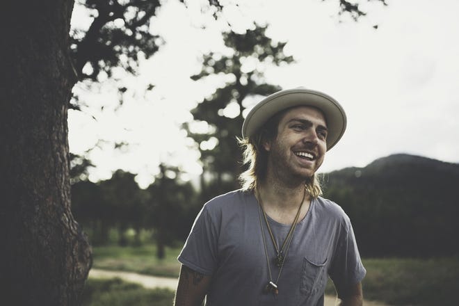 Singer-songwriter Trevor Hall's music is a blend of roots, reggae and folk, imbued with his respect for Eastern mysticism. [Emory Hall]