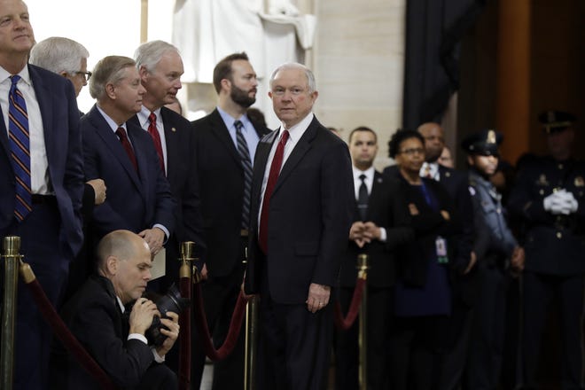 Attorney General Jeff Sessions talks to Sen. Lindsay Graham, R-S.C., as they wait for the ceremony to begin honoring the Rev.d Billy Graham in the Rotunda of the U.S. Capitol building on Wednesday in Washington. President Donald Trump lashed out again at his attorney general early Wednesday. [Evan Vucci/The Associated Press]
