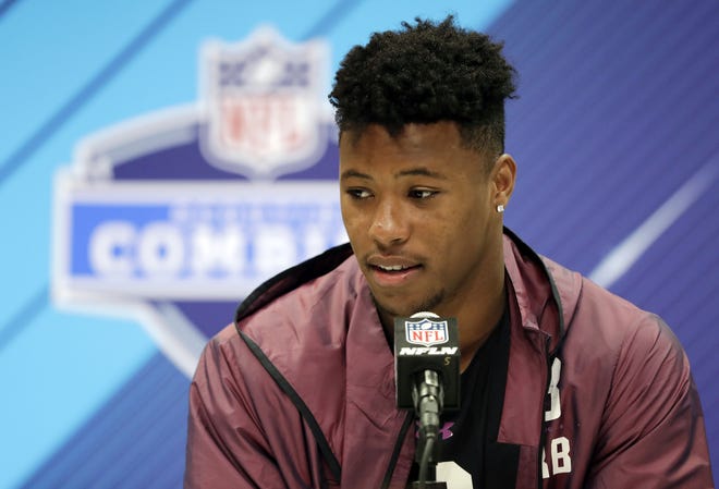 Penn State running back Saquon Barkley, expected to be one of the top picks in April's draft, answers questions Thursday at the NFL scouting combine in Indianapolis. [The Associated Press]