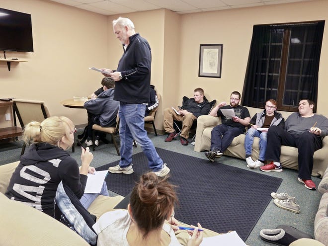 The Rev. Dan Brown leads a senior youth group in discussion at a recent gathering at First Baptist Church of Sunbury. The church will change its name soon to The Bridge, dropping "Baptist" in a move to bring in new members.
