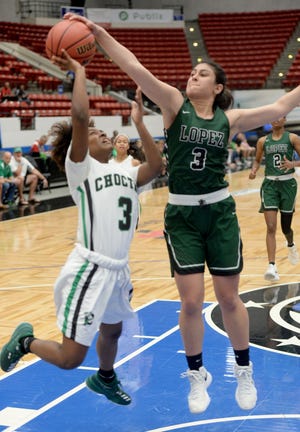 Father Lopez's Madi Camporese (3) blocks the shot of Choctawhatchee's Ataliya Brown (3) during their Class 7A semifinal in Lakeland on Friday. [The Ledger/Scott Wheeler]