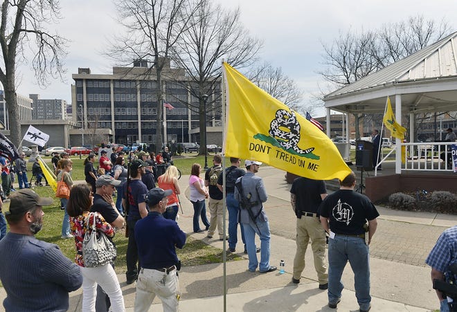 Gun-rights advocates rally in Perry Square in April 2014. They were celebrating a January 2014 Commonwealth Court ruling that struck down a city of Erie ordinance that outlawed guns in parks. The city had used the ordinance to charge eight people at a gun-rights rally in Perry Square in June 2013. [FILE PHOTO/ERIE TIMES-NEWS]