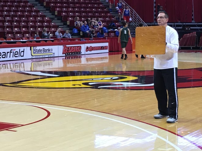 Richwoods assistant girls basketball coach Kevin Metzger takes part in a shootaround this weekend at the Class 3A state finals at Redbird Arena in Normal. AARON FERGUSON/JOURNAL STAR