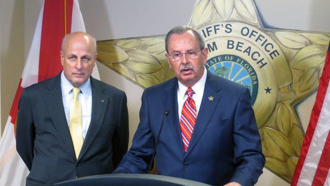 Chuck Wexler, executive director of the Washington, DC-based Police Executive Research Forum, and Palm Beach County Sheriff Ric Bradshaw announce at a March 2, 2018, news briefing a joint study of how agencies handle an “active shooter” incident similar to the Feb. 14 massacre at Marjory Stoneman Douglas High School in Parkland. (Eliot Kleinberg/The Palm Beach Post)