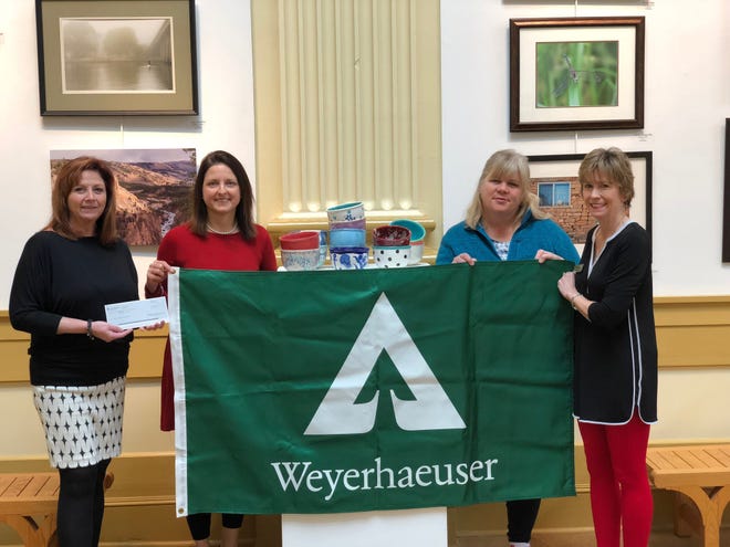 Lori Flowers and Lori Worley of Weyerhaeuser Company recently presented a $1,000 check for the company's Diamond Sponsorship of Empty Bowls. Empty Bowls proceeds benefit Religious Community Services and the Craven Arts Council to help nurture the creative process and feed hungry people in Craven, Jones and Pamlico counties. Pictured are, from left, Flowers, Worley, Juliet Rogers, executive director of RCS, and Eileen Bress of Craven Arts Council. [CONTRIBUTED PHOTO]