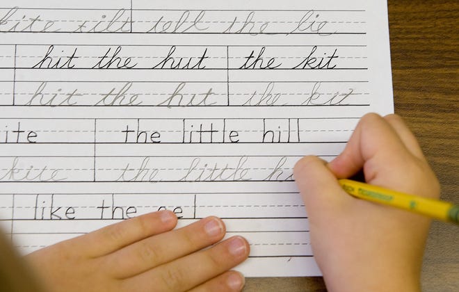 This Sept. 16, 2009 photo shows a student practicing both printing and cursive handwriting skills in the six to nine year old's classroom at the Mountaineer Montessori School in Charleston, W.Va. [AP Photo/Bob Bird]