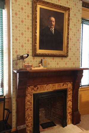 A portrait of Williiam Howard Taft's hangs over a fireplace in his boyhood home in Cincinnati, Ohio. [Steve Stephens]