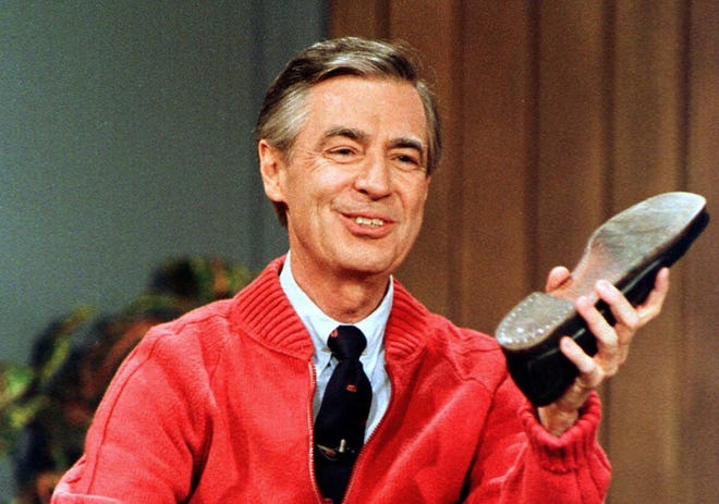 Fred Rogers rehearsing "Mister Rogers' Neighborhood" during a taping in Pittsburgh [AP FILE PHOTO]