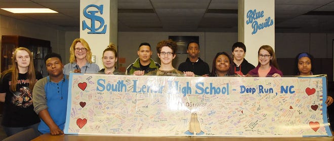 Students at South Lenoir High School signed a custom banner and sent letters to students at Majory Stoneman Douglas High School in Parkland Floriday. [Submitted photo]