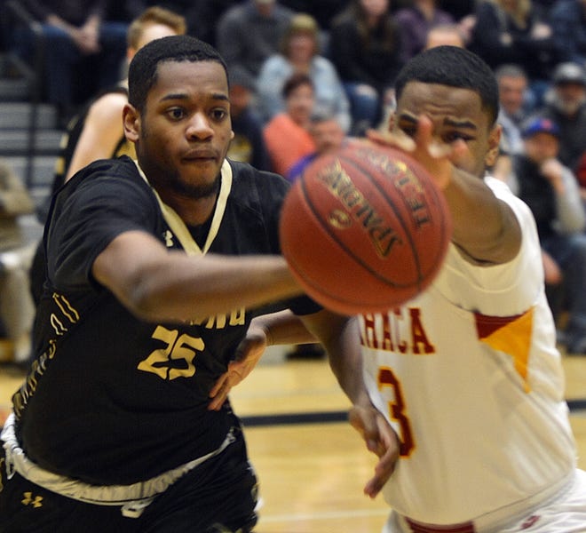 Corning's Myles Bankston and Ithaca's Jamar Nembhard chase down a loose ball. [ERIC WENSEL/THE LEADER]