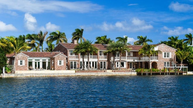 Viewed from the Lake Worth Lagoon, a restored landmarked house at 330 Island Road has changed hands for a recorded $17.68 million after being listed at just under $20 million by the Corcoran Group. Photo by Andy Frame, courtesy of the Corcoran Group