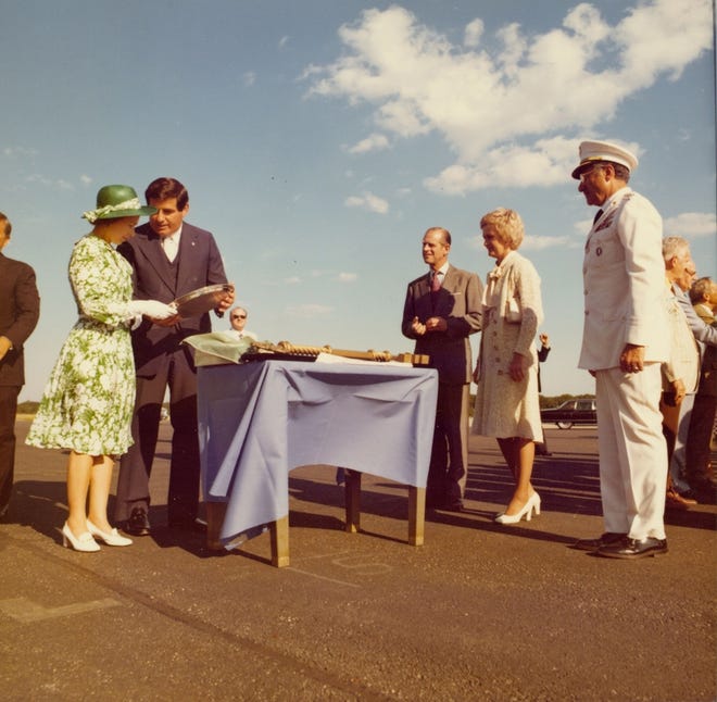 Rhode Island Gov. Philip Noel, second from left, presents a gift to Queen Elizabeth II during Bicentennial celebrations in Newport in 1976. Prince Philip is to the right of Noel. [Rhode Island Bicentennial Commission / Louis Notarianni]