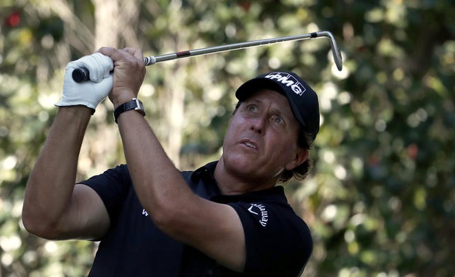 Phil Mickelson, of the U.S., watches his shot on the 17th hole during the third round of the Mexico Championship at the Chapultepec Golf Club in in Mexico City, Saturday, March 3, 2018. (AP Photo/Eduardo Verdugo)