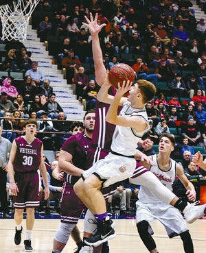 Oppenheim-Ephratah-St. Johnsville's Jack Brundage (1) drives to the hoop against Whitehall's Bryce Eddy during the Section II Class D championship game Saturday at the Cool Insuring Arena in Glens Falls. [JAMES A. ELLIS/THE LEADER HERALD]