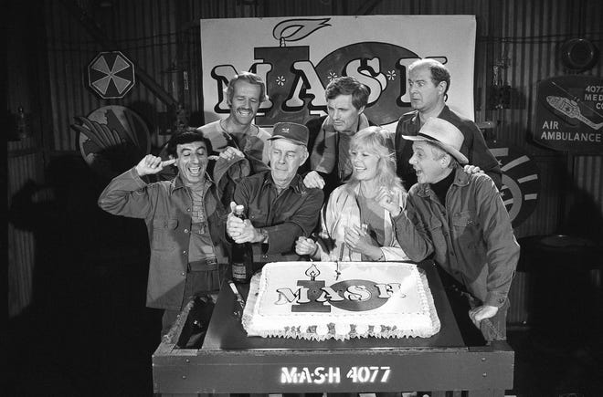 In this Oct. 22, 1981, file photo, Jamie Farr, from front left, plugs his ears as cast members of the "M.A.S.H." television series cast Harry Morgan, Loretta Swit, William Christopher and, from back from left, Mike Farrell, Alan Alda and David Ogden Stiers celebrate during a party on the set of the popular CBS program in Los Angeles. Stiers a prolific actor best known for playing a surgeon on the television series "M.A.S.H." has died, the actor's agent Mitchell Stubbs confirmed Saturday night, March 4, 2018, in an email. He was 75. (AP Photo/Huynh, File)