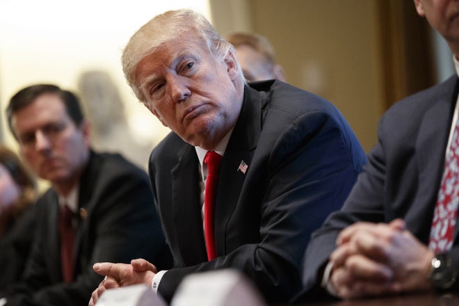 President Donald Trump listens during a meeting with steel and aluminum executives in the Cabinet Room of the White House, Thursday, March 1, 2018, in Washington. Trump's announcement that he will impose stiff tariffs on imported steel and aluminum has upended political alliances on Capitol Hill. (AP Photo/Evan Vucci)